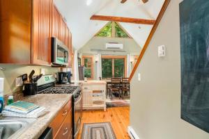 a kitchen with a sink and a stove top oven at The Stonewater Lodge in Traverse City +22 photos