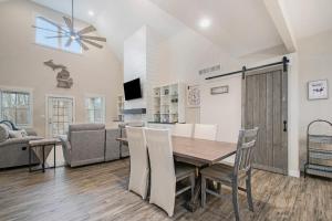 a kitchen and living room with a table and chairs at Hidden Serenity in Sawyer +21 photos