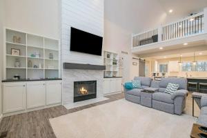 a living room with a couch and a fireplace at Hidden Serenity in Sawyer
