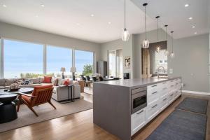 a kitchen and living room with a couch and a table at Leisure On The Lake in New Buffalo +23 photos