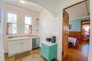 a kitchen with a sink and a counter at The Blacker House in Manistee +32 photos