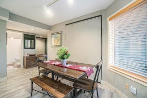 a dining room with a table and chairs and a bathroom at Wintergreen Condo, Unit #543 in Thompsonville