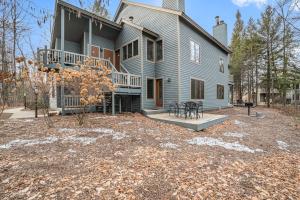 a large house with a large yard in front of it at Wintergreen Condo, Unit #543 in Thompsonville