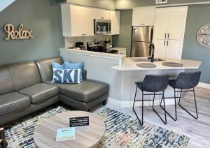 a living room with a couch and a table and a kitchen at Wintergreen Condo, Unit #543 in Thompsonville +22 photos