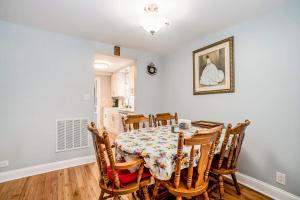 a dining room with a table and chairs at South Haven Heaven in South Haven