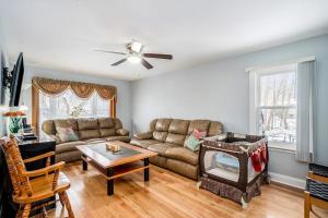 a living room with a couch and a fireplace at South Haven Heaven in South Haven