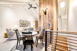 a living room with a table and chairs at Dune House in Manistee +39 photos