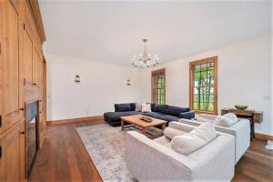a living room with a couch and a table at Sorellina House in Maple City