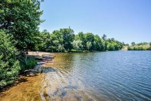 a river with several boats on the shore at Beach House in Saugatuck