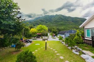 an aerial view of a yard with mountains in the background at danyang deulggochyanggi in Danyang