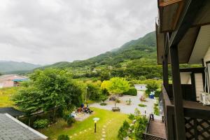a view of a garden from a house at danyang deulggochyanggi in Danyang
