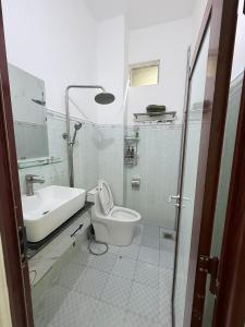 a bathroom with a toilet and a sink at Ba Doan 2 in Con Dao +29 photos