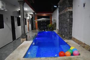 a swimming pool with a bunch of balls in it at hotel del valle in Coatzacoalcos