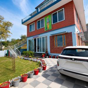 a car parked in front of a house at Thano Retreat in Dehradun
