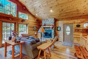 a living room with a couch and a fireplace at Ridge Wood in Empire