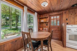 a dining room with a table and a window at Cottage Living in Beulah