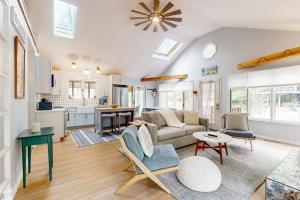 a living room with a couch and a table at Livywood Cottage in New Buffalo