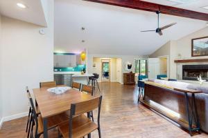 a kitchen and living room with a table and a couch at The Tree House in New Buffalo