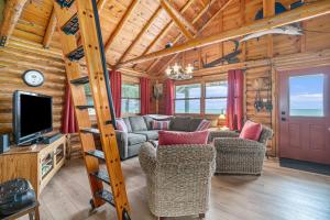 a living room with a couch and chairs in a cabin at Cedar Crest in Empire