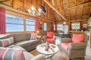 a living room with a couch and a table at Cedar Crest in Empire