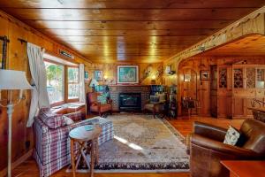a living room with a couch and a fireplace at Empire Lodge in Empire