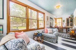 a living room with two couches and a window at The Bright Side in Union Pier