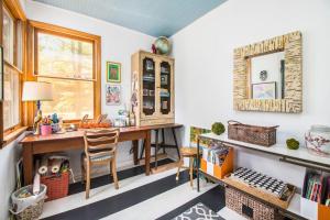 a home office with a desk and a window at The Bright Side in Union Pier