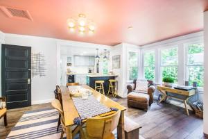 a kitchen and living room with a table and chairs at The Bright Side in Union Pier