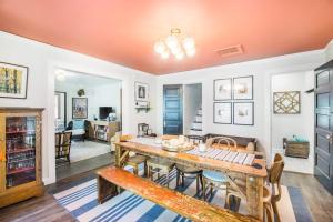a living room with a wooden table and chairs at The Bright Side in Union Pier