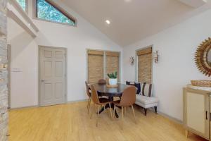 a dining room with a table and chairs at Lilly Bell Villa in Three Oaks +17 photos