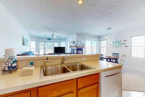 a kitchen with a sink and a counter top at Northern Michigan Manistee Magic in Manistee