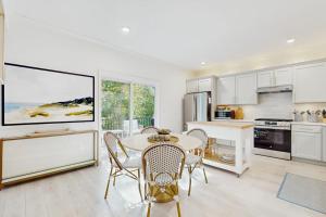 a kitchen with a table and chairs in a room at Wrightwood Cottage in South Haven +11 photos