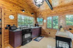 a kitchen with wooden walls and a wooden ceiling at Peterson Mill in Saugatuck
