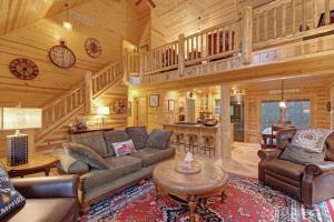 a living room with a couch and a table in a cabin at Kingfisher Cove Cabin 2 in Saugatuck
