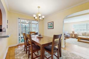 a dining room with a table and chairs at Wine Down Cottage in Union Pier