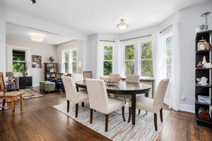 a dining room and living room with a table and chairs at Three Oaks Retreat in Three Oaks