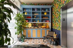 a room with a blue shelf with vases on it at Hotel Casa Canita in Miami Beach +32 photos