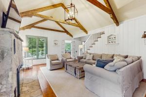 a large living room with a couch and chairs at Chalet May in Michiana