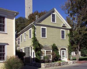 a green house with a chimney on top of it at Paul Revere in Provincetown