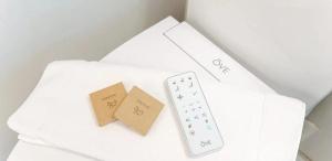 a wii remote control and two cards on a table at Myles Standish in Provincetown