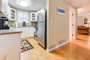 a kitchen with a large stainless steel refrigerator at Island Sanctuary in Oak Bluffs