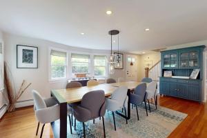 a dining room with a table and chairs at Bumps River Bungalow in Centerville