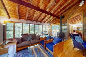 a living room with a couch and a fireplace at Old Kings Hideout in Wellfleet