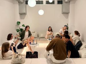 a group of people sitting around a room at TSUKIMI HOTEL in Kyoto