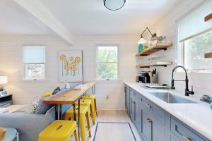 a kitchen with a sink and a counter top at Long Pier Lodge in Provincetown