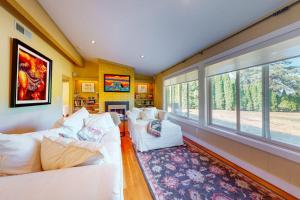 a living room with two white couches and a fireplace at Yellow Brick Road House in Oak Bluffs +22 photos
