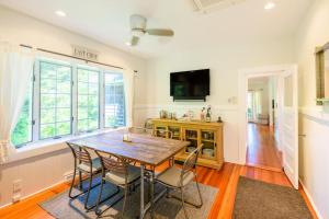 a dining room with a wooden table and chairs at East Chop 90 in Oak Bluffs
