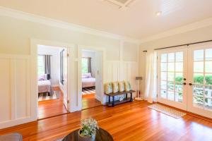 a living room with a couch and a bedroom at East Chop 90 in Oak Bluffs