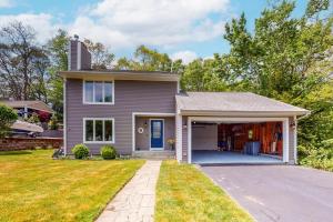 a house with a garage and a driveway at Birch Grove in Mashpee