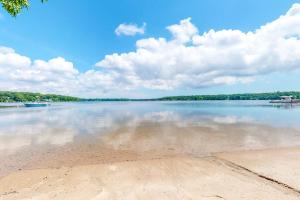 a large body of water with trees in the background at Follins Estate in Yarmouth Port +38 photos